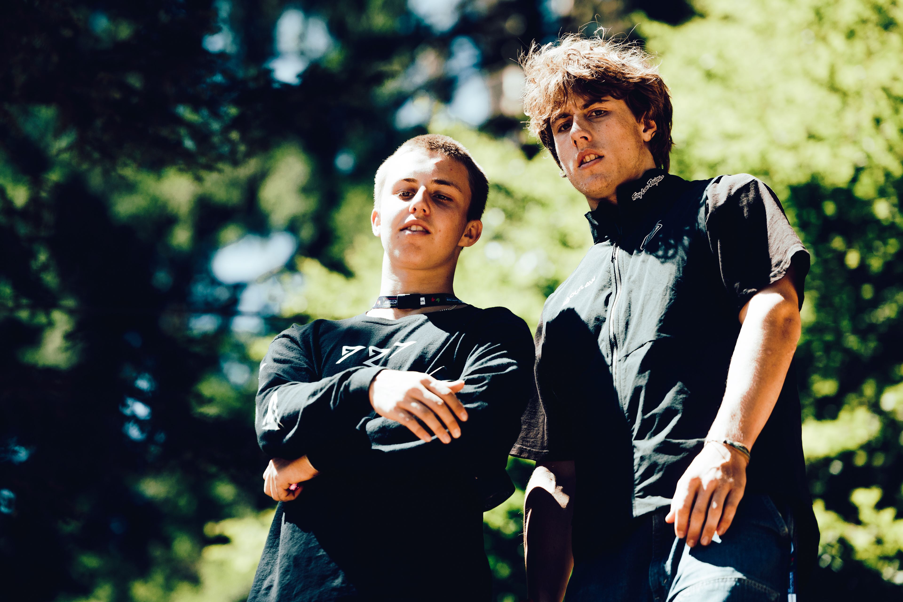 Reed Russell with a teammate in the forest between races